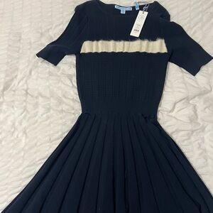 Navy dress with cream detail. Brand new never worn.
